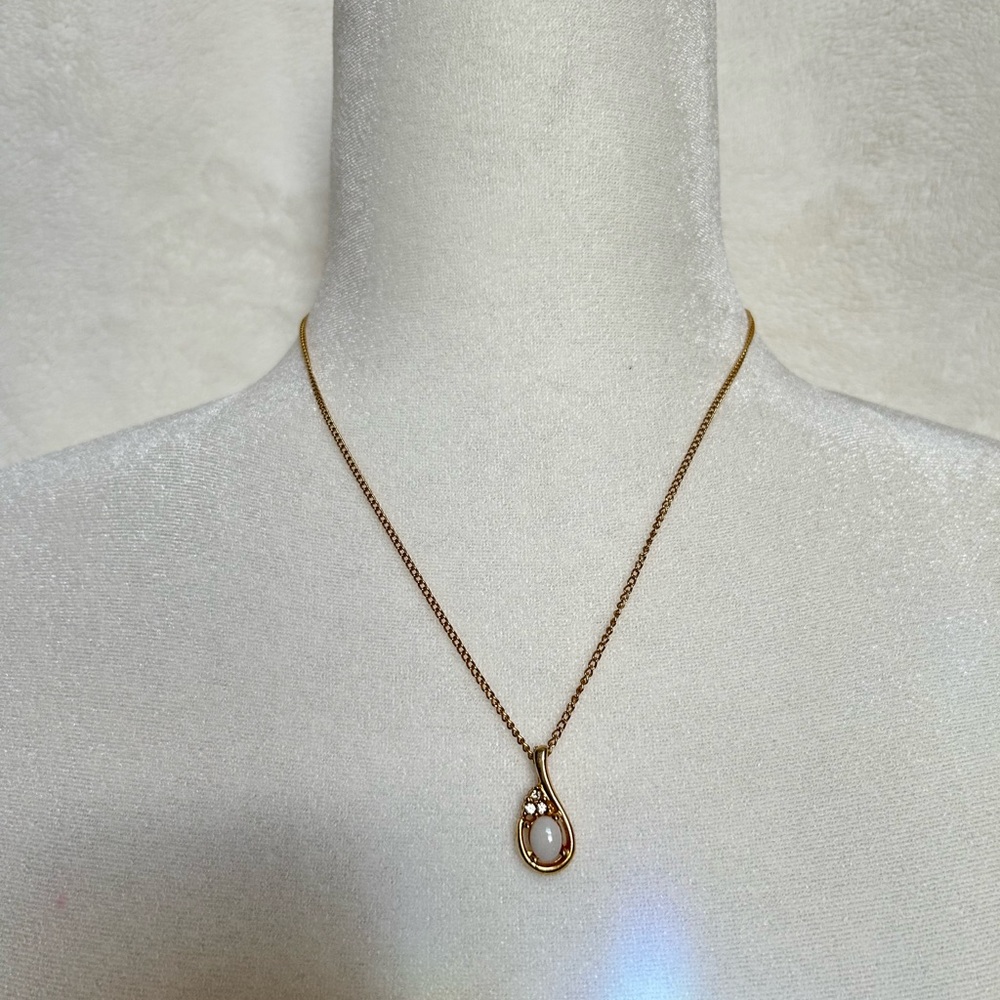 And beautiful necklace with a charm like a rain drop